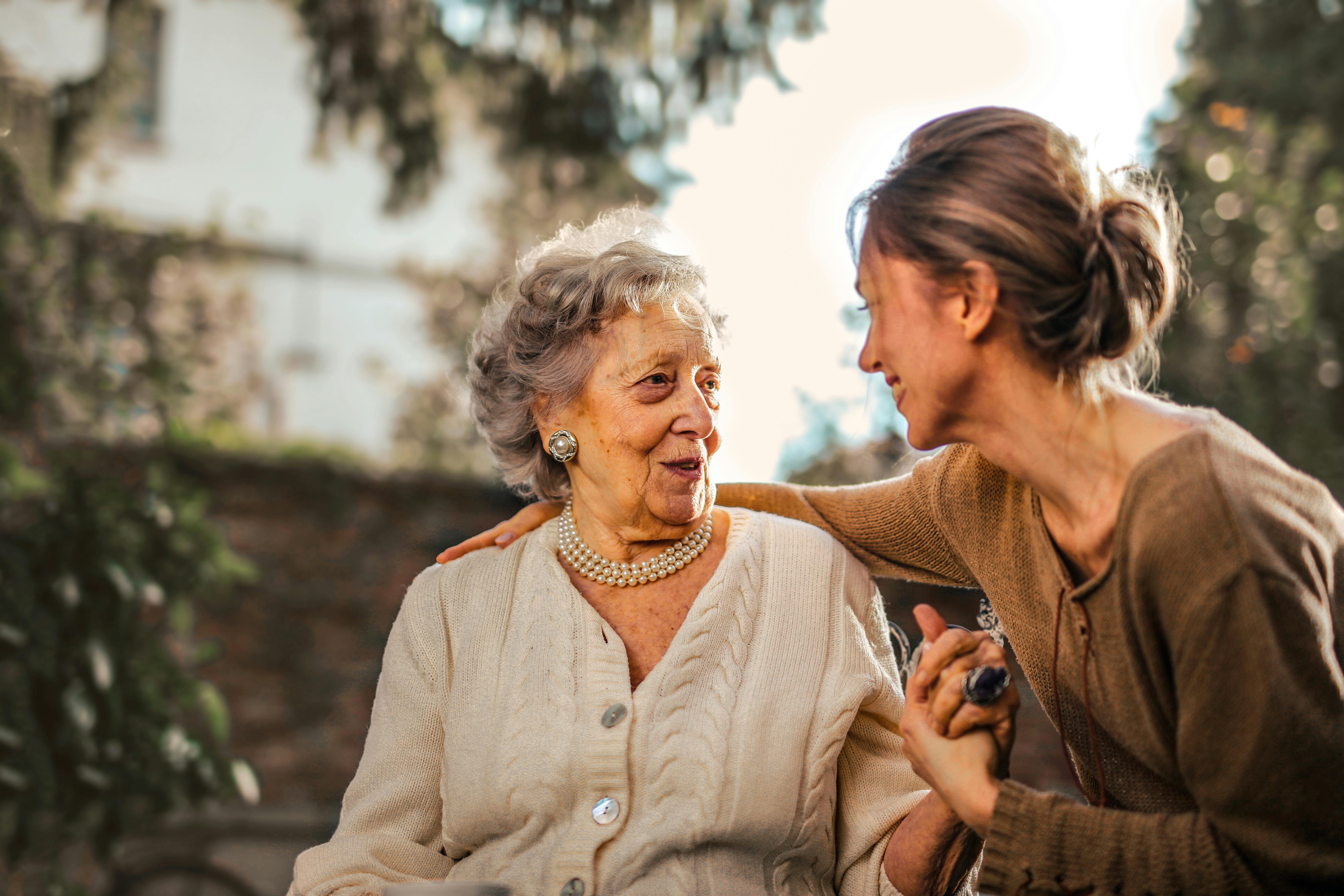 Family members sitting together at a table discussing senior care decisions